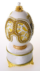 Decorative easter egg for jewellery (Faberge egg) on background