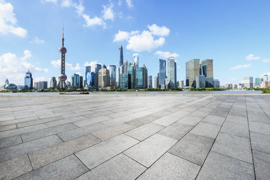 Empty city square floor and modern city commercial buildings scenery in Shanghai,China