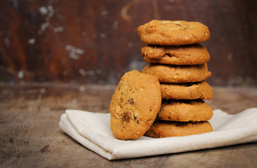 Oatmeal raisin cookie isolated on a wooden background