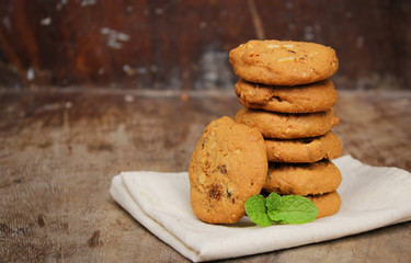 Oatmeal raisin cookie isolated on a wooden background