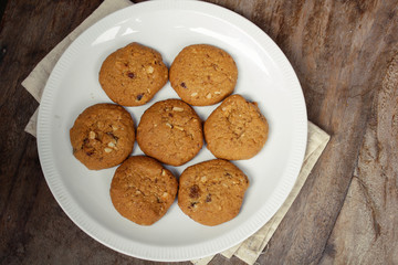 Oatmeal raisin cookie isolated on a wooden background