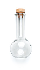 Transparent glass bottle of unusual shape with a wooden lid on a clean white background..