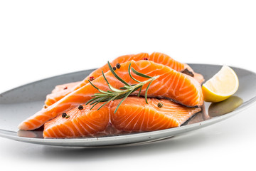 Salmon. Raw salmon steaks herb peper lemon on white background.