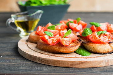 Traditional Italian bruschetta with tomatoes and spinach