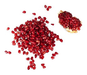 Pomegranate seeds on white
