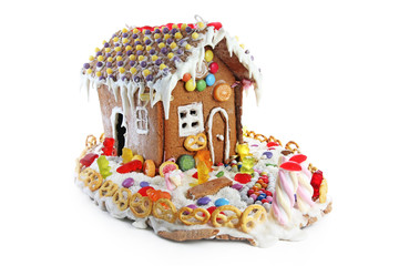 Gingerbread candy sugar house. Fairy tail candyhouse covered with snow and colorful candies Homemade gingerbread house with colorful candy decoration. Christmas ornaments. Cute christmas house. Cute.