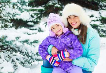 Fototapeta na wymiar mother and daughter in winter