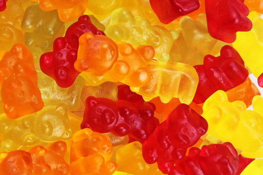 Gummy bear background. Gummy bears as texture. Gum bear candy colorful pattern. Gummy bears.