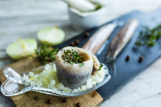 Delicious wrapped herring with fresh herbs and onions.