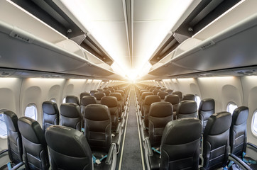 Passenger seat, Interior of airplane with passengers sitting on seats.