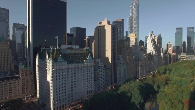 Aerial real time shot, camera is hovering above Central park and turning right toward West 95th Street