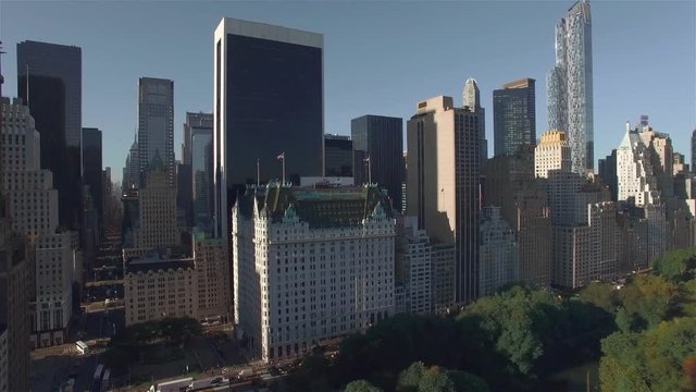 Aerial real time shot, camera is hovering above Central Park and filming buildings on West 95th Street, Downtown Manhattan.
