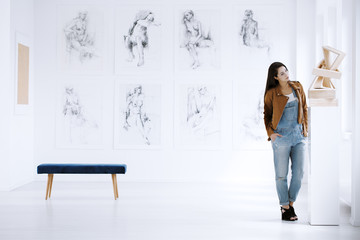 Girl looking at sculpture