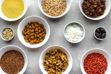 Table with food, selection of superfoods, fruits, berries, nuts, seeds, ingredients of healthy breakfast