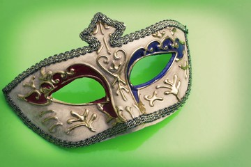 carnival mask on color background