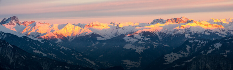 the mountains of the Rhine Valley near Church at sunset in winter panorama view