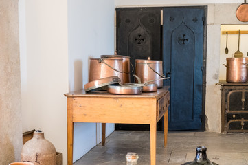 Fototapeta na wymiar Typical portuguese kitchen equipped with copper kitchenware