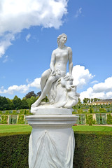 Marble sculpture against the background of grape terraces in the park of Sanssousi. Potsdam, Germany