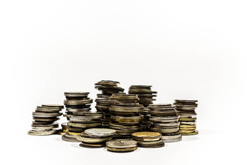 A stack of coins on a white background. Isolated stacks of coins.