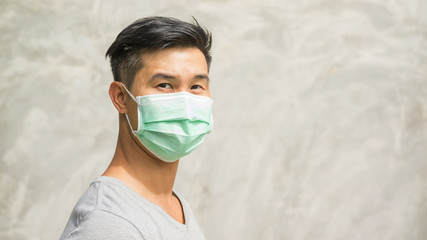 Asian man wears a protective mask.