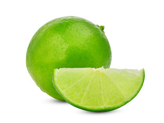 whole and slices fresh green lime isolated on white background