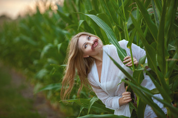 Woman has attached herself a mustache, she flirts playfully.