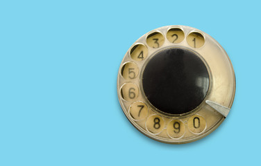 vintage disc phone on turquoise background