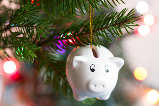 Save money and christmas concept with piggy bank and tree