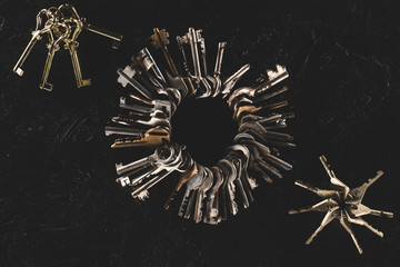 top view bunches of different keys isolated on black