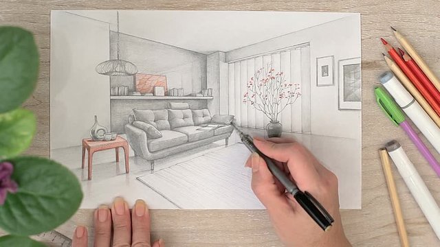 Woman arms drawing sketch of sofa