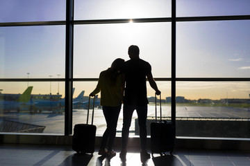 Couple waiting for flight in airport