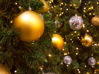 Obraz na płótnie Canvas Christmas ball hanging on abstract lights background