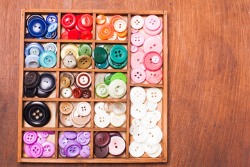 Colorful buttons in box