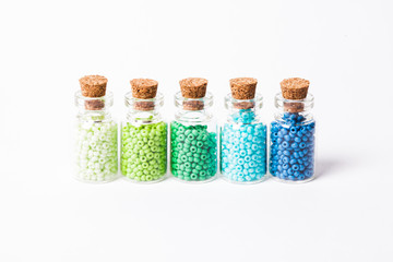Colorful beads in the bottles