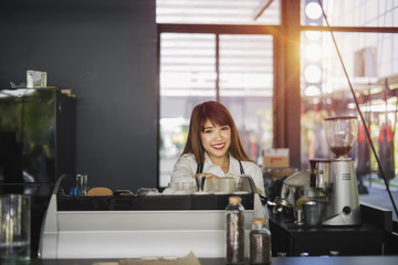 Fototapeta na wymiar Asian woman working in coffee shop cafe barista concept 