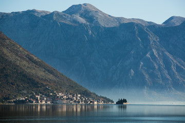 View of the city on the Adriatic sea coast in Montenegro. Misty landscape