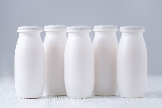 drink yogurt bottles on gray background