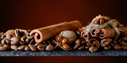 Roasted coffee beans with spices .