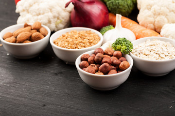 Fresh raw vegetables with nuts and cereals for cooking or eating. Vegetarian food.