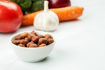 Fresh raw vegetables with nuts and cereals for cooking or eating. Vegetarian food.