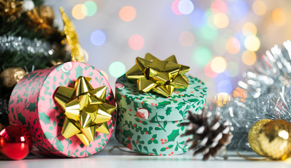 christmas decoration on bright background, gift boxes and tree