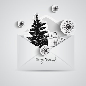 Christmas card with paper snowflakes and Christmas trees inside open envelope. Paper elements in black style