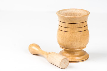 Wooden mortar isolated above white marble background with copy space