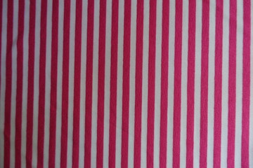 Vertical pink stripes on fabric from above