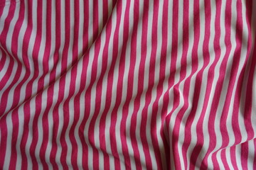 Crumpled striped fabric in pink and white