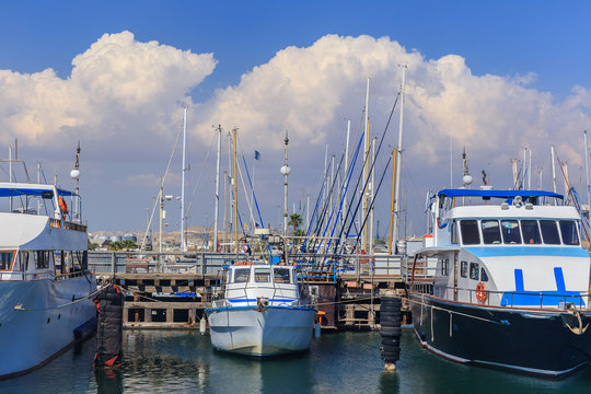 Yachts and boats on the quay in the marina