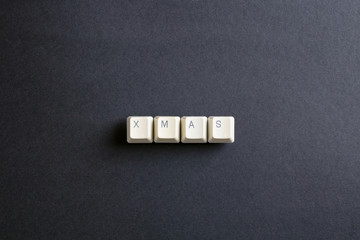 Xmas word. Flat lay view from above on the table with computer k