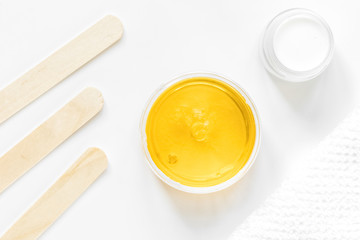 concept depilation with wax on white background top view