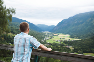 Man at Wooden Fence