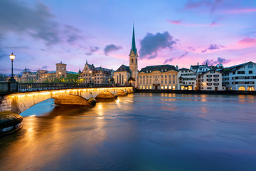 Fototapeta na wymiar Panoramic view of historic Zurich city center with famous Fraumunster Church and river Limmat at Lake Zurich , in twilight, Canton of Zurich, Switzerland.